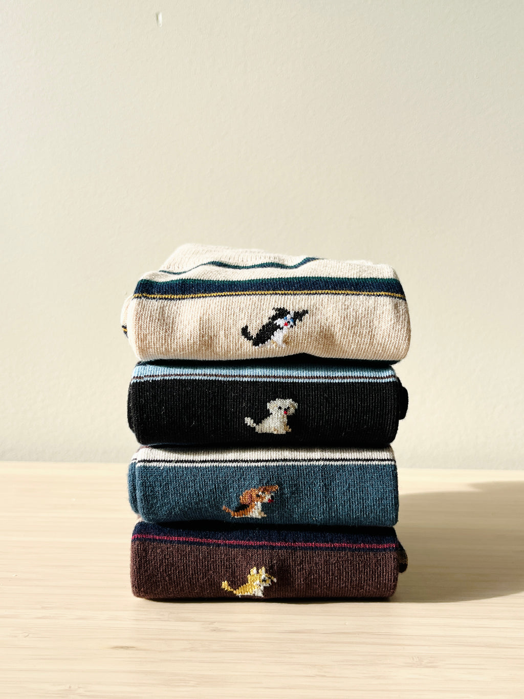 Unisex combed cotton crew socks featuring a cute dog illustration and classic stripes