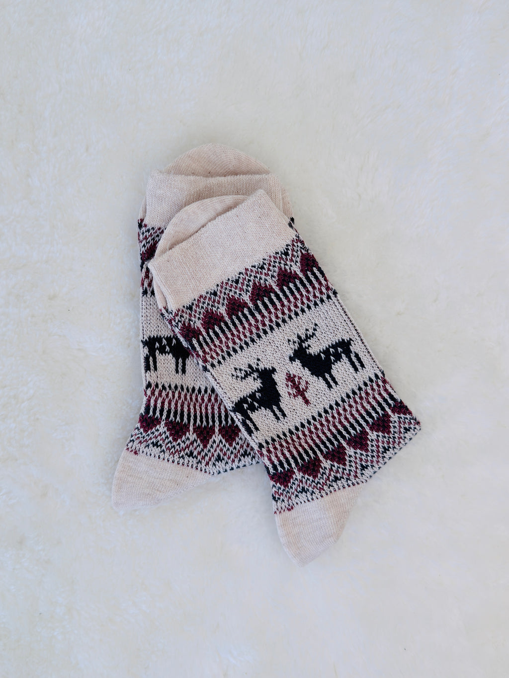 Cozy small-sized winter crew socks featuring red and navy Nordic reindeer patterns, perfect for women or youth. Ivory Colour