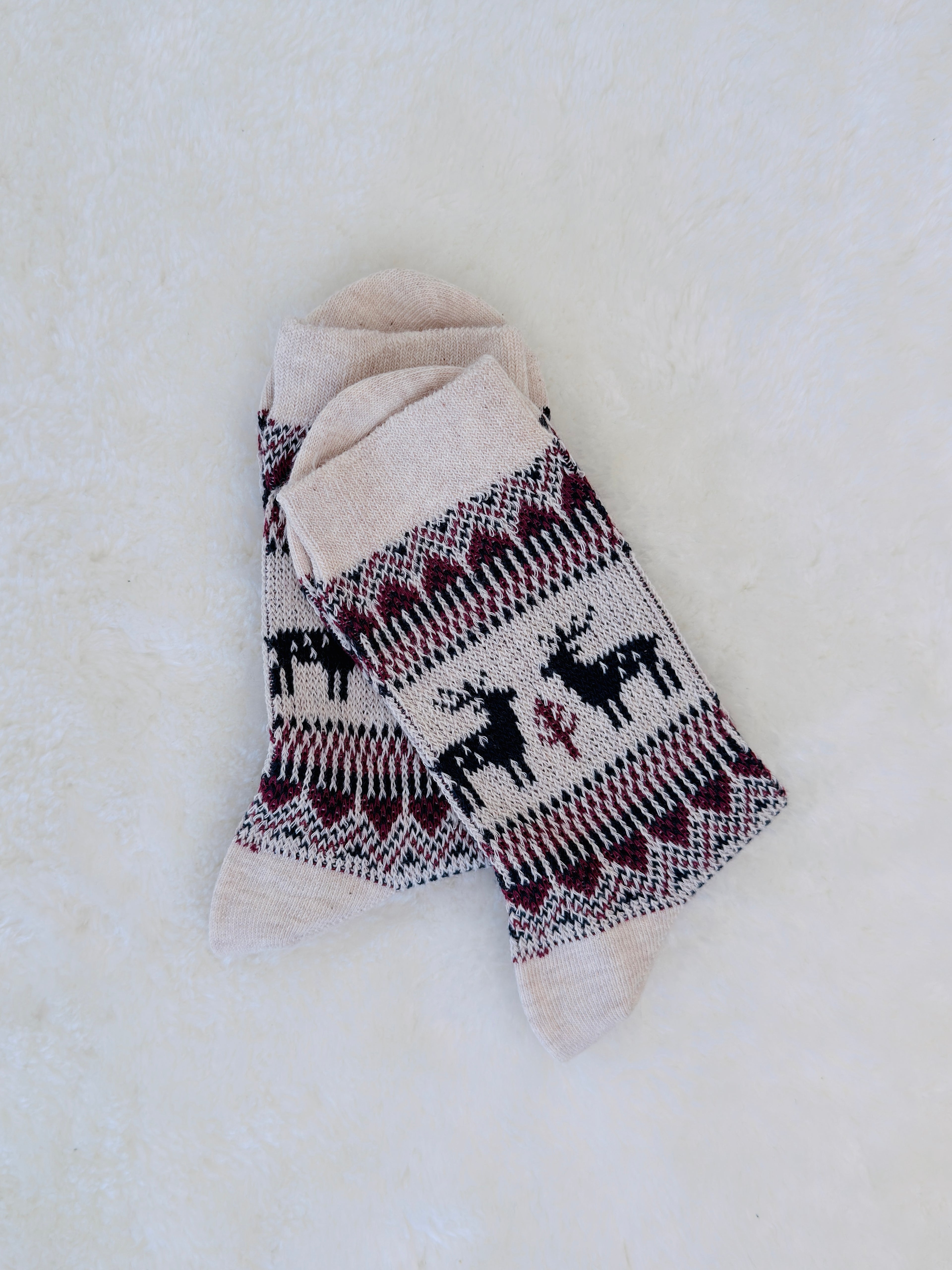 Cozy small-sized winter crew socks featuring red and navy Nordic reindeer patterns, perfect for women or youth. Ivory Colour