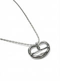 Silver necklace with a pretzel pendant on a white background